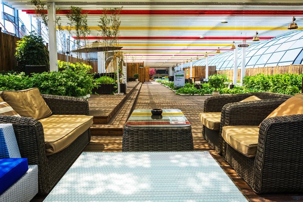 A covered outdoor lounge with rattan furniture at a commercial property, the asset 3A Allied Insurance covers under Commercial Property Insurance Florida.