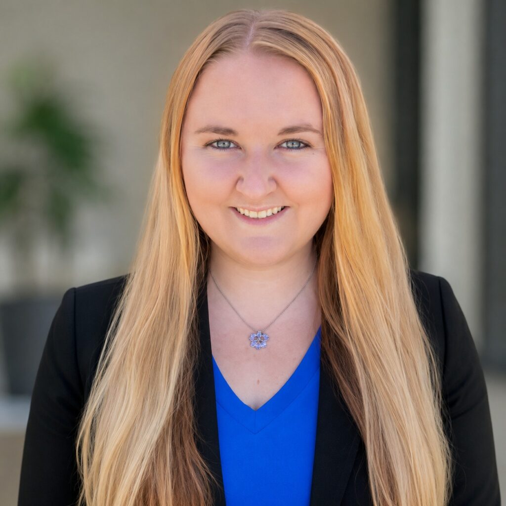 Caryn Weimann, 440 CSR at 3A Allied Insurance, smiling in a black blazer and blue top in front of a softly blurred building exterior.