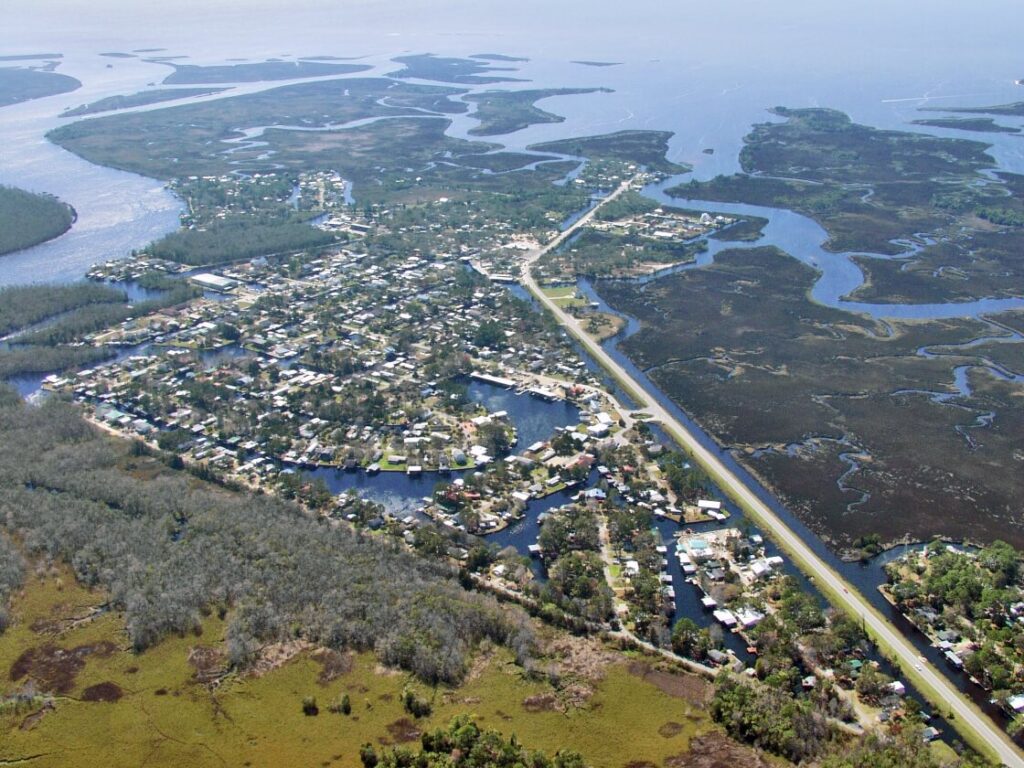 Dixie Insurance coverage area aerial image of a waterfront community surrounded by marshland along the Big Bend shoreline in Florida.