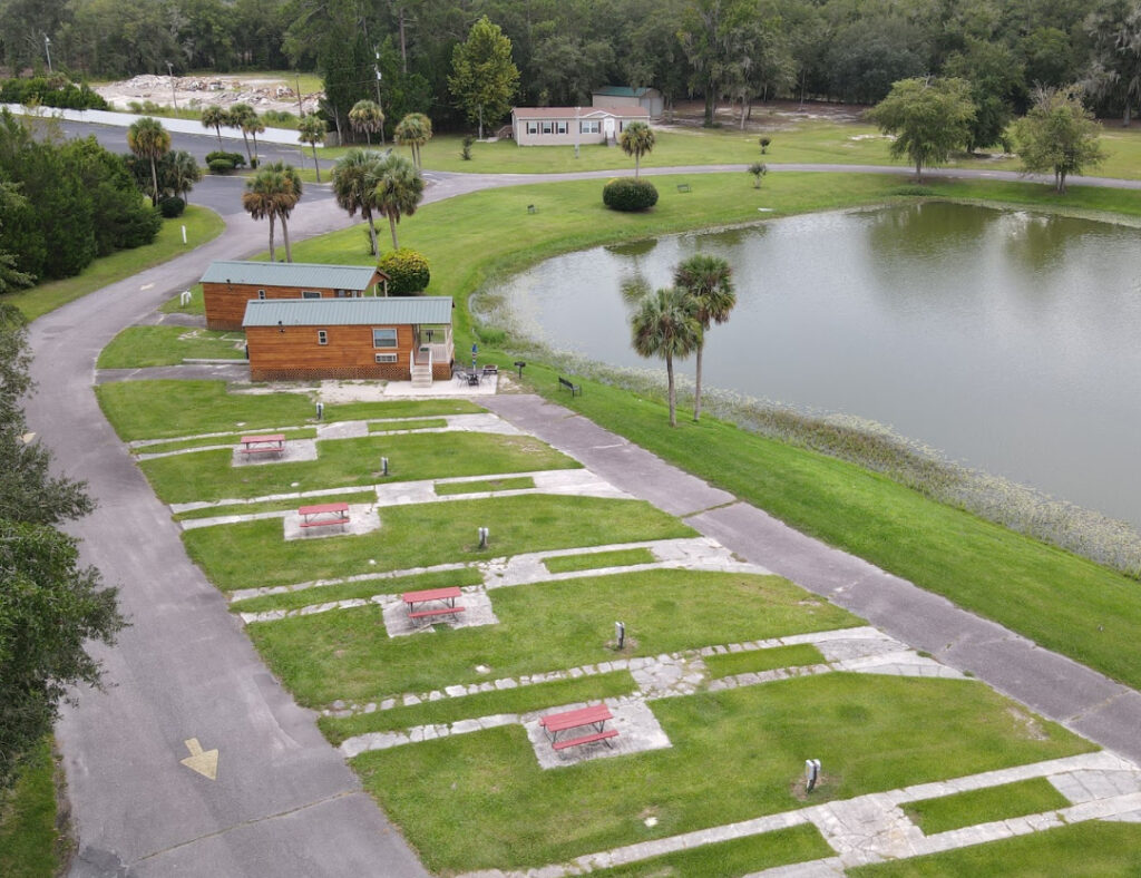 A rural Hamilton County property with cabins, a pond, and picnic areas surrounded by farmland, the setting Hamilton County Insurance is built to cover.
