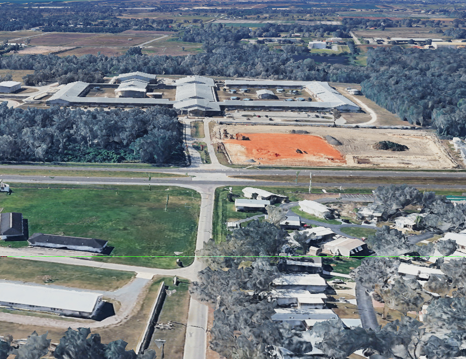 Aerial view of a rural Hardee County property with farmland and outbuildings, showing the agricultural setting Hardee County Insurance protects.