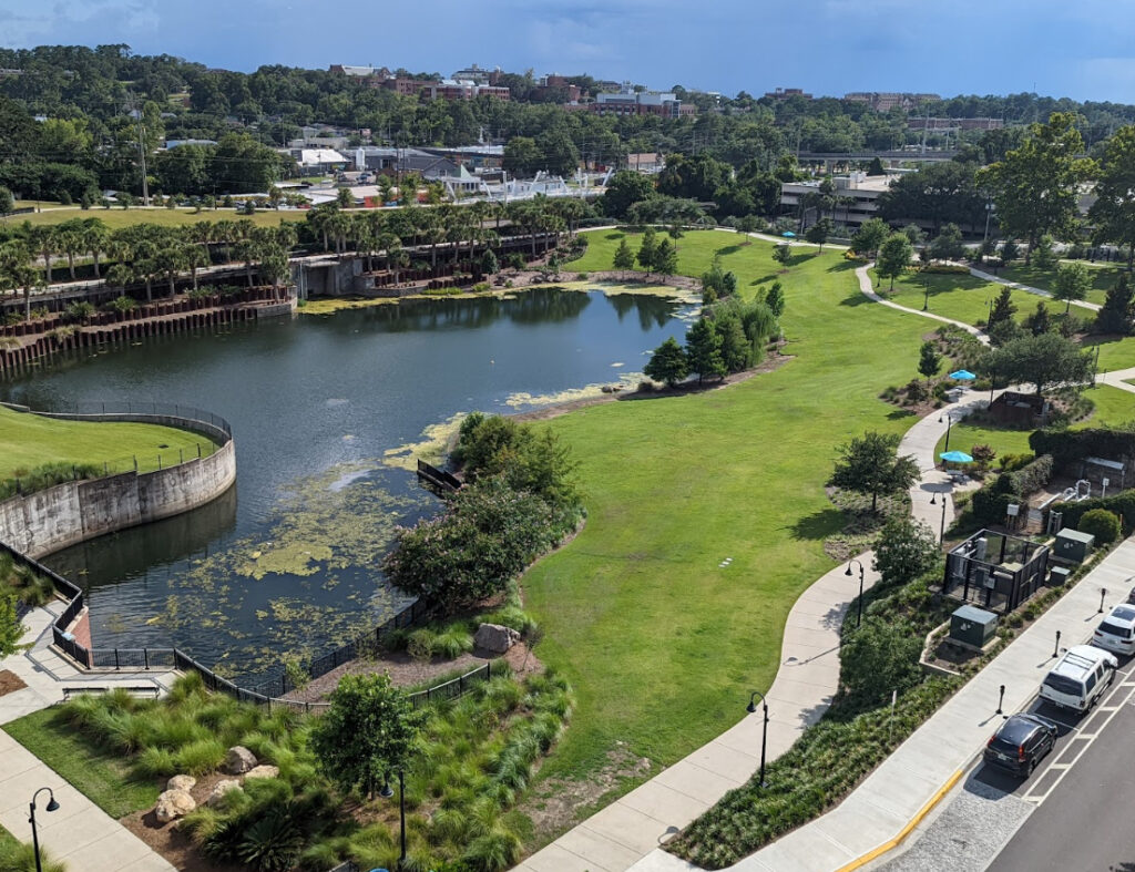 A park pond and city skyline in Tallahassee, the urban business community 3A Allied Insurance protects with Leon County Insurance.