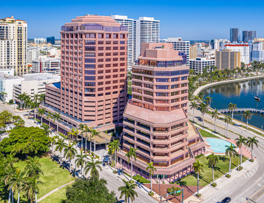 Pink high-rise office towers with palm-lined streets in downtown Orange County, the urban growth 3A Allied Insurance covers with Orange County Insurance.